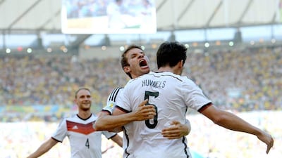 Mats Hummels celebrates with Thomas Muller and Benedikt Howedes after his goal against France on Friday at the 2014 World Cup. Marcus Brandt / EPA / July 4, 2014