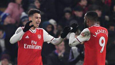 Arsenal's Brazilian striker Gabriel Martinelli, left, celebrates scoring against Chelsea during the 2-2 draw at Stamford Bridge. AFP