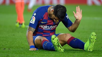 Barcelona's Uruguayan forward Luis Suarez reacts to missing a goal opportunity against Real Valladolid at the Camp Nou stadium in Barcelona on October 29, 2019. / AFP / LLUIS GENE