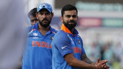 India captain Virat Kohli, right, made the same mistake on Sunday Sourav Ganguly made in the 2003 World Cup final. Kirsty Wigglesworth / AP Photo