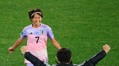 Japan's Hinata Miyazawa celebrates her goal with coach Futoshi Ikeda during her side's 3-1 win against Denmark in the Women's World Cup round of 16 in Wellington. AFP