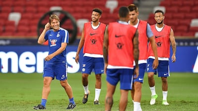 Chelsea manager Antonio Conte, left, smiles. Thananuwat Srirasant / Getty Images