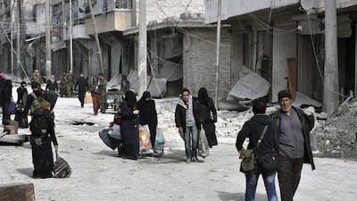 Residents flee east Aleppo as government forces pushed into rebel-held areas. AP Photo