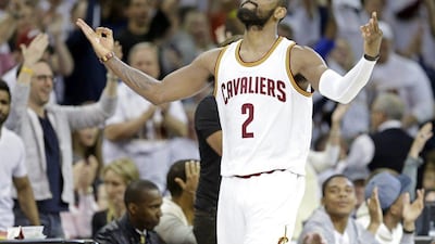 Kyrie Irving reacts after making a three-pointer on Sunday in the Cleveland Cavaliers' NBA play-offs win over the Boston Celtics. Mark Duncan / AP / April 19, 2015