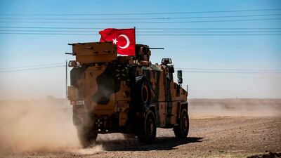 A Turkish military vehicle on patrol in the Syrian village of Al Hashisha on the outskirts of Tal Abyad. AFP