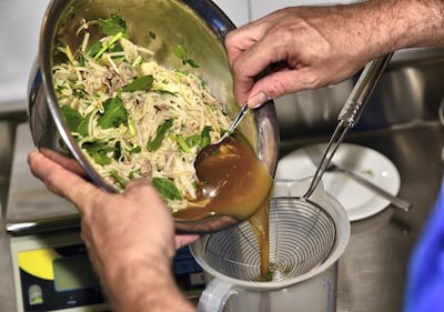 Gelato-maker Ralf Ehresmann passes pho soup through a sieve before turning it into gelato. Photo: Ronan O’Connell