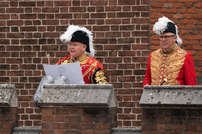 David Vines White, left, the Garter King of Arms, proclaims King Charles III as the new monarch. Getty