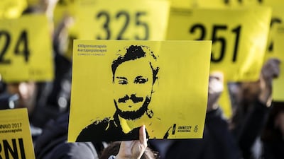 People attend a march in Rome in 2016 in memory of Giulio Regeni, who was tortured and killed in Cairo, while in Egypt as a research student. AP