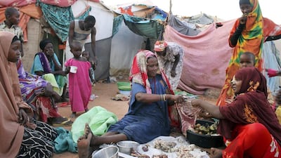 Women displaced from the capital Mogadishu chop meat to sell to customers in the once-bustling pirate town of Galkayo, Somalia. Farah Abdi Warsameh / AP