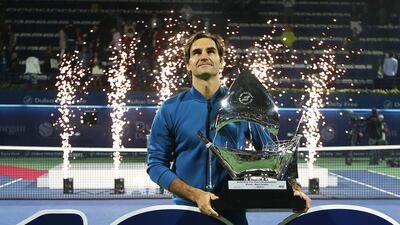 Tennis champ Roger Federer poses with his trophy after defeating Stefanos Tsitsipas of Greece in their final match at the Dubai Duty Free Tennis ATP Championships 2019 in Dubai. EPA