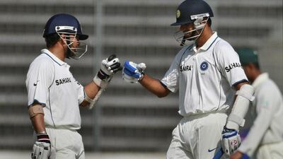 The India batting legends Sachin Tendulkar, left, and Rahul Dravid have 91,659 runs between them across all three formats. Pavel Rahman / AP Photo