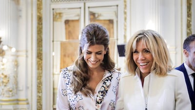 Argentinian President Mauricio Macri's wife Juliana Awada and French President Emmanuel Macron's wife Brigitte laugh during a ceremony at the Casa Rosada Presidential Palace. Reuters