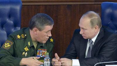 President Vladimir Putin, right, speaks with the head of the Russian armed forces, Valery Gerasimov, at a meeting with top military officials in Moscow on December 11, 2015. Alexei Druzhinin/Sputnik, Kremlin Pool Photo via AP