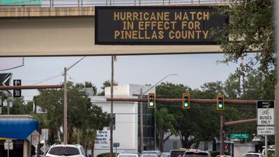 A sign warning drivers to prepare for Hurricane Ian in St Petersburg, Florida. EPA