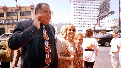Greeting the press, along with his wife Cecilia and son Flynn, at the premiere of The Lion King in Los Angeles, in June 1994. AP