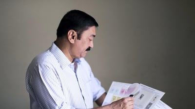 Ummer Farook browses his Gandhi stamp collection. Umer won a silver award for his collection on Gandhi at a recent international exhibition in China. More than 20 countries have issued stamps over the past year to commemorate the 150th birth anniversary celebrations that began in October last year. All photos by Reem Mohammed / The National