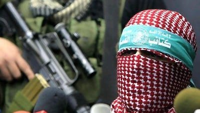 Abu Abida, the spokesman for the armed wing of the Islamist movement Hamas, Ezzedine al-Qassam Brigades, speaks during a press conference in Gaza City, on December 25, 2010. AFP PHOTO/MAHMUD HAMS
