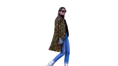 Dress up those blue jeans with an animal-print jacket. Christian Vierig / Getty Images