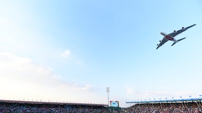 An Emirates plane flies over the pitch to celebrate the event's 50th anniversary at the World Rugby Sevens Series in Dubai in 2019. Getty Images
