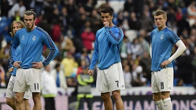 Real Madrid’s Welsh forward Gareth Bale (L), Real Madrid’s Portuguese forward Cristiano Ronaldo (C) and Real Madrid’s German midfielder Toni Kroos warm up before the Champions League quarter-final second leg football match Real Madrid v Wolfsburg at Santiago Bernabeu stadium in Madrid on April 12, 2016. AFP / JAVIER SORIANO