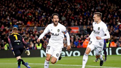 Dani Parejo, centre, celebrates his goal for Valencia. EPA