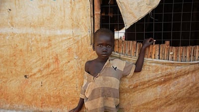 A South Sudanese refugee child looks on as as the United Nations High Commissioner for Refugees visits the Nyumanzi transit centre in Adjumani, north of the capital Kampala. The international community must respond to the refugee crisis caused by fighting in South Sudan in the same way it responded to the crisis in Europe, the UN refugee chief Filippo Grandi said in Uganda. Isaac Kasamani / AFP