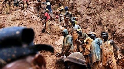 Men work in a gold mine in Chudja, near Bunia, north eastern Congo, one of the conflict areas watchdogs want to stop illicit trading from. AFP PHOTO / LIONEL HEALING