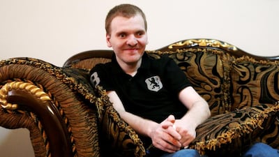 Zaid, who suffers from Multiple Sclerosis, at his family's flat in Abu Dhabi. Christopher Pike / The National