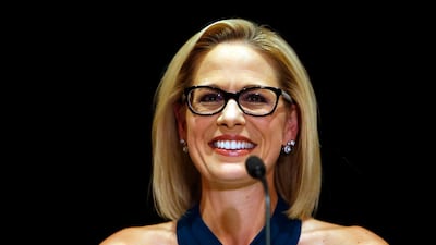 Kyrsten Sinema, smiles after her victory over Republican challenger U.S. Rep. Martha McSally. AP