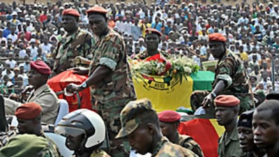 Guinean soldiers escort the coffin of Lansana Conté during yesterday's funeral ceremony in Conakry.