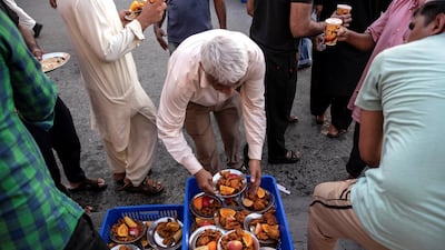Iftar meals distributed at the New Fatima Mosque adjacent to the Al Ghubaiba Bus Station in Bur Dubai. Antonie Robertson / The National