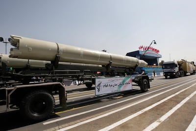 A Qiam missile, the kind believed to have been fired by Yemeni rebels at Saudi Arabia, is displayed by Iran's Revolutionary Guard during a military parade. Vahid Salemi / AP Photo