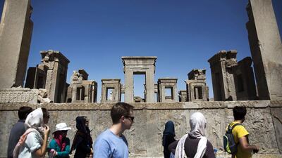 European and Iranian tourists visit the Tachara Palace. Official figures show that at the end of March, tourist numbers were up 35 per cent year-on-year to 4.5 million, bringing in $6 billion. Iran, with 17 Unesco-listed World Heritage sites, wants 20m visitors within a decade. Behrouz Mehri / AFP