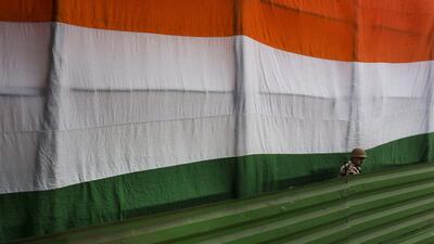 A paramilitary soldier stands guard during the rehearsals for the Republic Day parade in New Delhi. Bernat Armangue / AP Photo