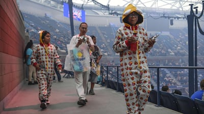 Fans dressed in costume attend day one of the Fortnite World Cup Finals at Arthur Ashe Stadium in the Queens borough of New York City. AFP