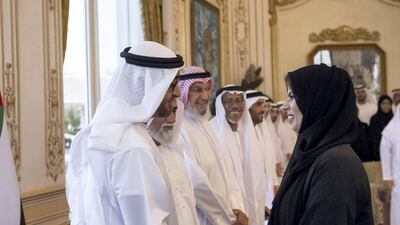 Sheikh Mohammed bin Zayed speaks to a delegate for Emirati Women's Day. Rashed Al Mansoori / Crown Prince Court - Abu Dhabi