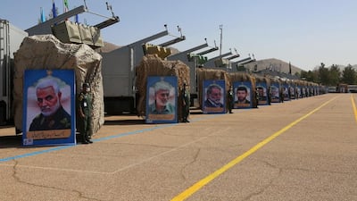 Military equipment on display at the Islamic Revolutionary Guard Corps' new missile city in Iran. In the foreground is a portrait of Maj Gen Qassem Suleimani, commander of the IRGC's Quds Force, who was killed in a US drone strike in 2020. EPA
