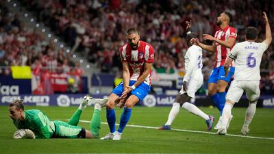 Atletico Madrid's Yannick Carrasco, centre, reacts after missing a chance. AP Photo