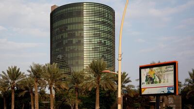 An advertisement for the Saudi Aramco initial public offering (IPO) stands on display beside a highway in Dhahran, Saudi Arabia. Bloomberg