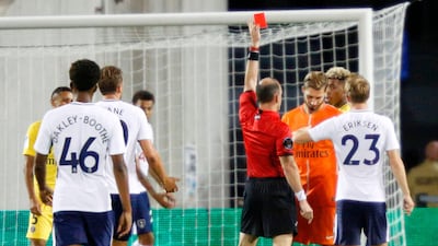 Paris Saint-Germain goalkeeper Kevin Trapp is sent off by referee Ted Unkel at the start of the second half of their friendly match against Tottenham Hotspur at Orlando. Trapp received the red card for touching the ball outside the 18-yard box. Gregg Newton / AFP