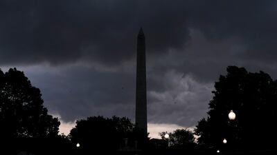 Storm clouds darken the sky over the Washington Monument. AP