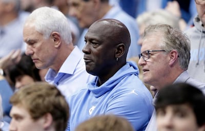 Michael Jordan, centre, who won six NBA titles in the 1990s with the Chicago Bulls, now owns the Charlotte Hornets. Gerry Broome / AP Photo
