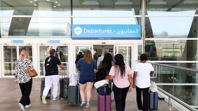 Passengers at Dubai International Airport. For countless people around the world, the UAE is not just a place they once lived. It remains a place they consider home. Chris Whiteoak / The National
