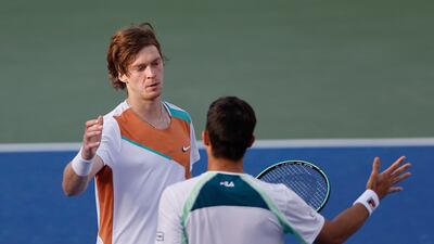 Andrey Rublev and Mackenzie McDonald greet each other at the net after their quarter-final match. Reuters