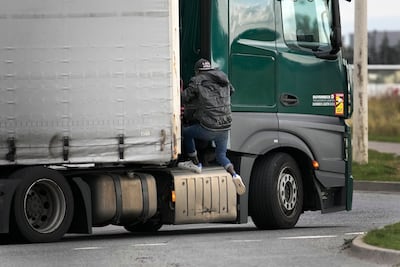 Just two to three migrants will successfully sneak on to a lorry per day, authorities say. AP.
