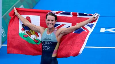 Gold medalist Flora Duffy of Bermuda celebrates after winning the women's individual triathlon at the 2020 Summer Olympics.