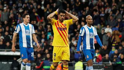 Barcelona's Luis Suarez reacts after missing a chance to score. Reuters