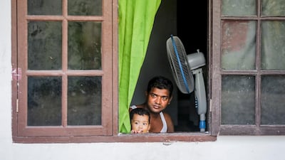 A Rohingya refugee plays with his son at a shelter ahead of World Refugee Day in Medan, North Sumatra, Indonesia. World Refugee Day is marked annually on 20 June. According to the UNHCR, more and more refugees today live in urban settings outside refugee camps. Some crises have lasted so long that the tent camps became built-up urban areas. EPA