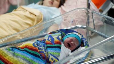 Newborn Ivan lies next to his mother as they shelter in the basement of a Kyiv perinatal centre. Reuters