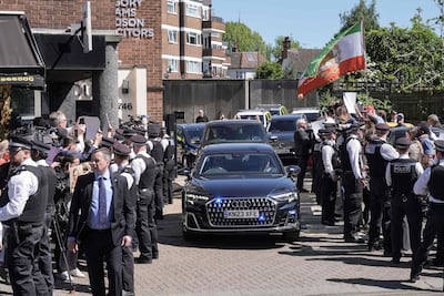 Police officers hold back lines of protesters as Me Starmer leaves. Stefan Rousseau / POOL / AFP